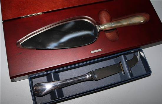 A silver handled cake slice, and a cheese knife